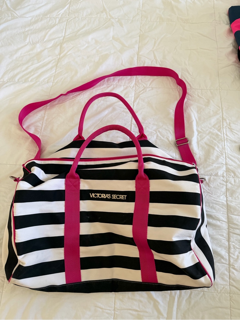 Victoria's Secret Black and White Striped Travel Bag with Hot Pink Accents.